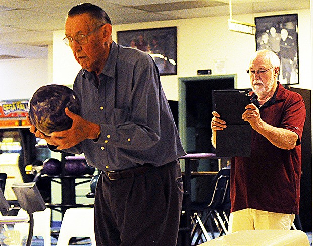 Ron Hoppe examines Austin Riley's form at Strawberry Lanes in Marysville.