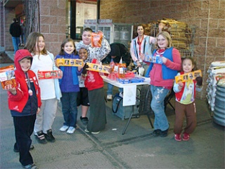 The Cedar Grove 'Superstars Mega Club' of Camp Fire USA sells candy at the Marysville Thriftway Jan. 24.