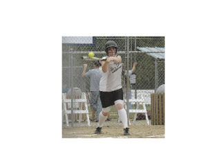 First baseman Bailey Hoge gets a hit for her Stilly Valley team. “You can throw the ball really hard at her and she’s going to dig it out of the dirt or pop up and get it