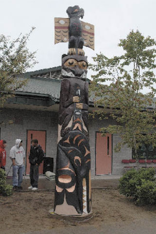 The finished story pole features images of an eagle