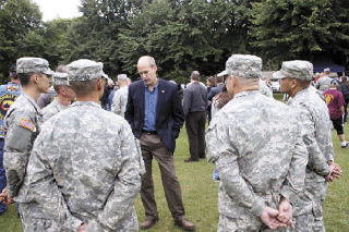 U.S. Rep. Rick Larsen talks with some local National Guardsmen