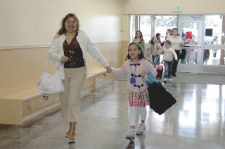 Mom Ada Garza brings her daughter Ivanna to Grove Elementary School for the first day of second grade.