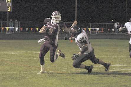 Lakewood quarterback Justin Lane avoids a Cedarcrest defender in its relentless blitzing Oct. 29.