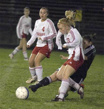 Danielle Norton avoids a slide tackle from a Snohomish defender Oct. 27.