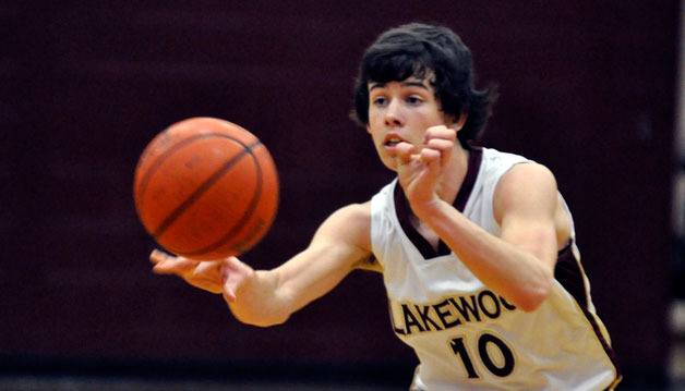 Senior guard Lucas Harkins passes the ball to a wing.