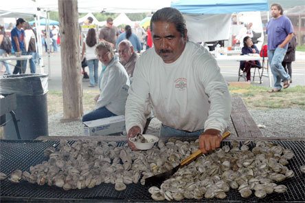 Phil Ancheta tends the grill at the Tulalip Days’ free clambake