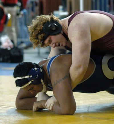 Tristan Nelson competes against Umu Timoteo in the Mat Classic XXV on Feb. 15.