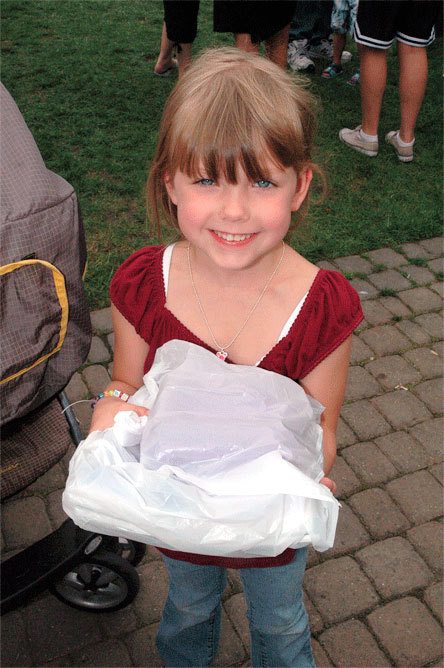 Marysville’s Lorelai Adams beams as she shows off her school supplies for kindergarten.