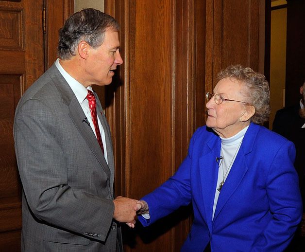 Washington state Gov. Jay Inslee greets Marysville’s Dorothy Roth at the governor’s mansion in Olympia on Jan. 7.