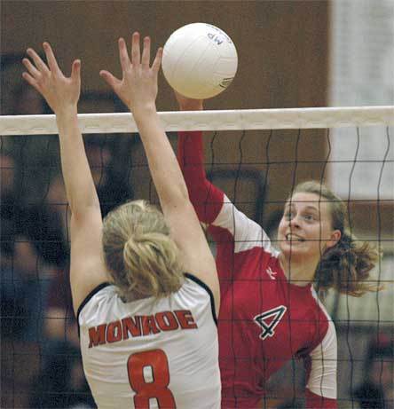 Senior outside hitter Mikayla Larosa goes up for a kill against Monroe during game 1.