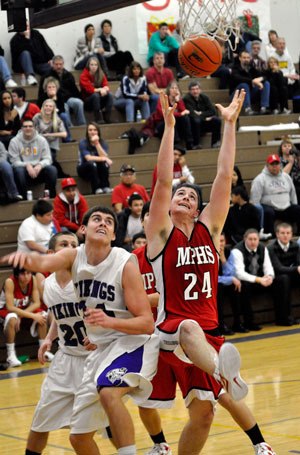 Marysville-Pilchuck senior post Calvin White looks to corral the ball against Lake Stevens on Dec. 20.