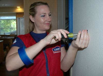 Lowe’s employee Caitlinn Slater works in one of the kitchens at the Everett Gospel Mission Women and Children’s Shelter on July 19.