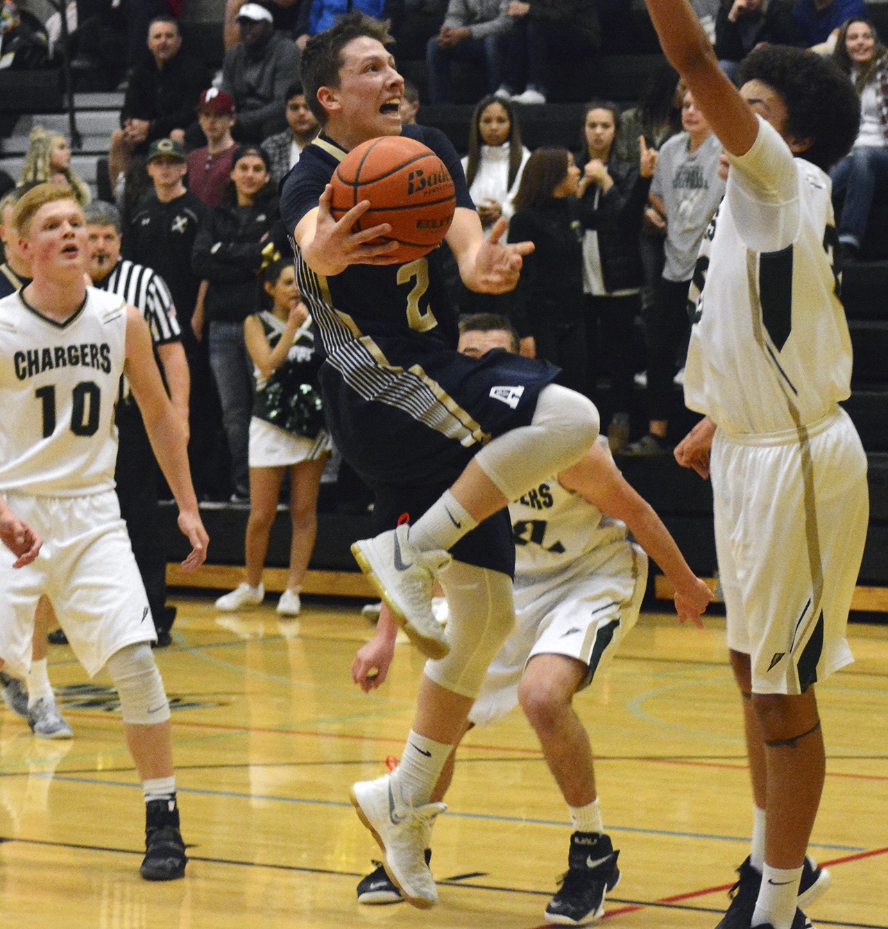 Arlington’s Sam Tregoning attempts a layup. Brandon Adam/Staff Photo