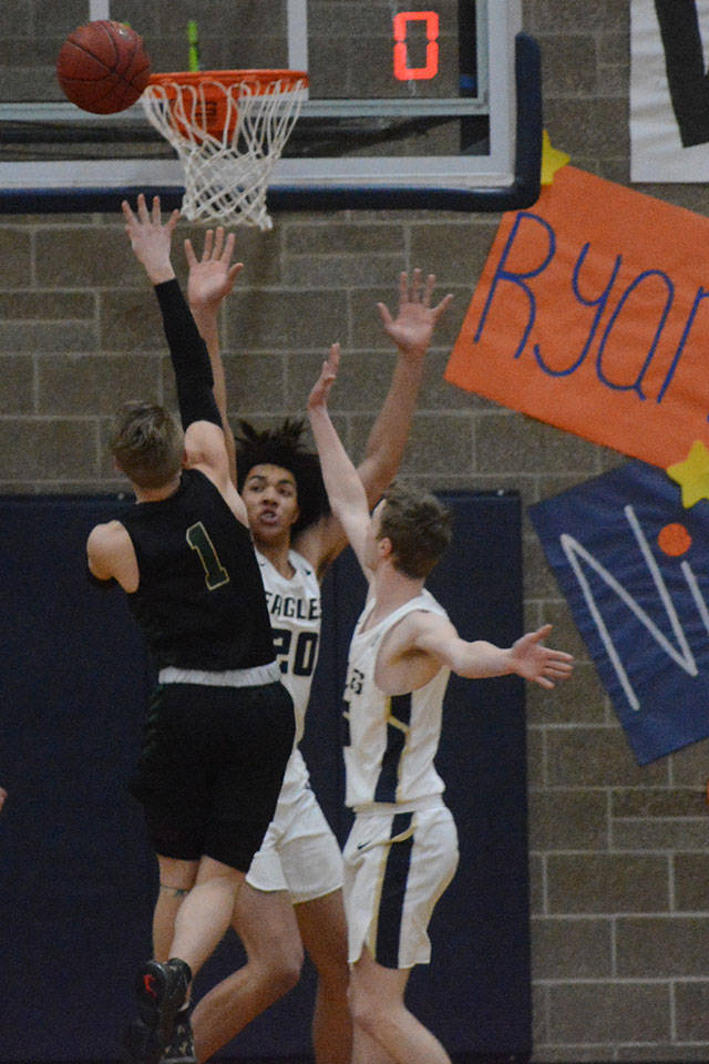 Josiah Koellmer of MG takes a shot over Will Abram of Arlington.